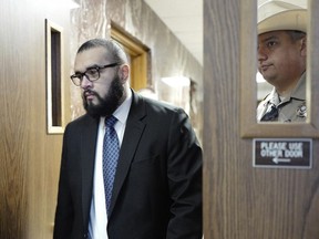 Victor Godinez enters the courtroom at the Hidalgo County Courthouse, Tuesday, Jan. 30 2024, in Edinburg, Texas. A Texas jury early Wednesday, Jan. 31, 2024, sentenced Godinez, a south Texas man, to death for fatally shooting a state trooper in 2019.