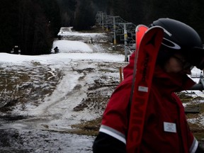 The slopes are bare near the base of Blackcomb Mountain in Whistler, B.C., on Friday, Dec. 29, 2023. British Columbians basked in a balmy December to wrap up 2023, but it wasn't quite warm enough to break temperature records.