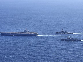 In this photo provided by South Korea's Joint Chiefs of Staff, the aircraft carrier USS Carl Vinson, left, sails with South Korean Navy's Aegis destroyer King Sejong the Great and Japan's Maritime Self-Defense Force Aegis destroyer Kongou in the international waters of the southern coast of Korean peninsular during a recent joint drill in 2024. The three countries conducted combined naval exercises involving the American aircraft carrier in their latest show of strength against nuclear-armed North Korea, South Korea's military said Wednesday, Jan. 17, as the three countries' senior diplomats were to meet in Seoul to discuss the deepening standoff with Pyongyang. (South Korea's Joint Chiefs of Staff via AP)