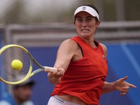 Canada's Rebecca Marino returns the ball to Argentina's Lourdes Carle during a women's single semifinals tennis match at the Pan American Games in Santiago, Chile, Saturday, Oct. 28, 2023. Canadians Rebecca Marino and Katherine Sebov will meet in the Australian Open qualifying tournament after both advancing to the final round.