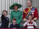 Prince William, right, Kate, Princess of Wales, centre, Princess Charlotte, bottom right, Prince George, left, and Prince Louis on the balcony of Buckingham Palace last June.
