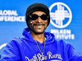 Rapper Snoop Dogg speaking at a conference