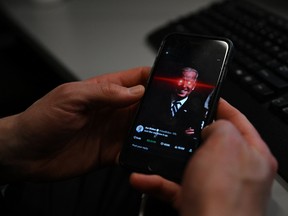 A phone shows U.S. President Joe Biden's X account