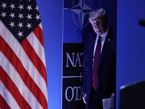 Then-U.S. president Donald Trump arrives to speak to the media at a press conference on the second day of the 2018 NATO Summit on July 12, 2018 in Brussels, Belgium. Leaders from NATO member and partner states are meeting for a two-day summit, which is being overshadowed by strong demands by Trump for most NATO member countries to spend more on defense.