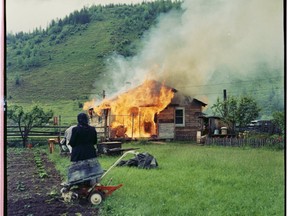 Woman watching a house burn