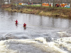 On May 7, 2020, rescue vehicles line the bank of the Salmon River in Truro, N.S., as responders search for Dylan Ehler.