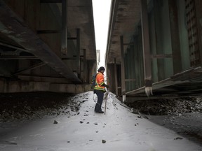 Dennis Hare, a friend of Jason Ehler’s, searches under a bridge on Jan. 9, 2022.