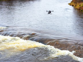 A search drone flies over the Salmon River on May 7, 2020.
