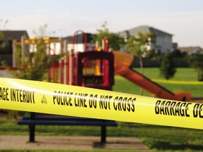 The playground next to St. Martha School in Fort McMurray, Alta. is taped off on Aug. 2, 2012