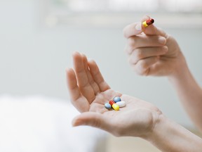 Woman taking vitamins and supplements