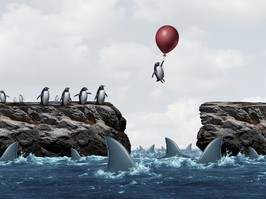 illustration of penguin floating away over sea of sharks