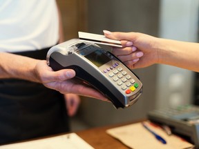 Close up of customer paying by credit card