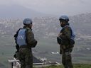 Spanish U.N. peacekeepers stand on a hill overlooking the Lebanese border villages with Israel in Marjayoun town on Wednesday, Jan. 10, 2024.