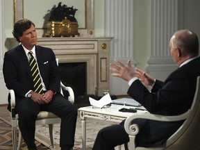 Former Fox News host Tucker Carlson speaks with Russian President at the Kremlin on Feb. 6, 2024.