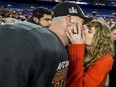 Taylor Swift kisses Kansas City Chiefs tight end Travis Kelce after an AFC Championship NFL football game against the Baltimore Ravens, Sunday, Jan. 28, 2024, in Baltimore. She won't be in uniform or on the field but Swift will certainly be a part of the Ontario sports betting's Super Bowl landscape. She is scheduled to be in Las Vegas on Sunday when Kansas City chases a second straight Super Bowl title versus the San Francisco 49ers.THE CANADIAN PRESS/AP-Julio Cortez