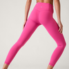 Model wearing bright pink leggings