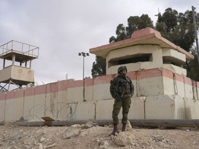 An Israeli soldier stands at the Nitzana border crossing with Egypt