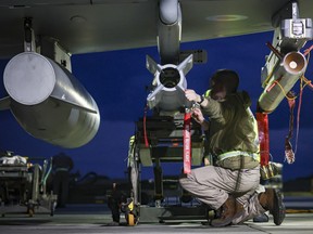 RAF Weapon Technicians prepare RAF Typhoon FRG4