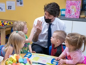 Prime Minister Justin Trudeau with children at a daycare.