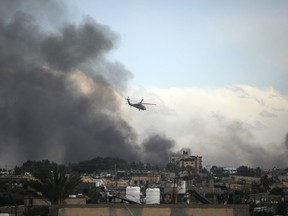 Omar Khan was organizing sessions connecting Canadians to Muslim therapists and setting up forums to address mental-health fallout related to the Israel-Hamas war when he learned his online therapy platform had lost access to its banking service without explanation. An Israeli helicopter flies over Khan Younis, Gaza Strip, Thursday, Feb. 15, 2024.