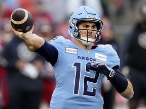 Toronto Argonauts quarterback Chad Kelly (12) makes the pass during first half CFL Eastern Division final football action against the Montreal Alouettes, in Toronto, Saturday, Nov. 11, 2023. The CFL says it's investigating after a lawsuit was issued by a former Toronto Argonauts strength-and-conditioning coach against the club for wrongful dismissal and quarterback Chad Kelly for alleged violations of the Ontario Human Rights Code.