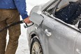 Man pumping gas