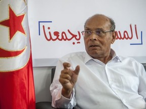 FILE - Former Tunisian President and head of el-Harak party Moncef Marzouki speaks to The Associated Press in Tunis, on Aug.28, 2019. A court in Tunisia this week handed down former President Moncef Marzouki an eight-year prison sentence in abstentia in the latest reflection of the country's ongoing crackdown against opponents of President Kais Saied.