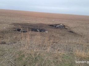 This image released by Moldova's Border Police on Sunday, Feb. 11, 2024, shows, according to the official statement, remains of a Shahed-type drone that crashed near the Etulia, Moldova, near the Moldova-Ukraine border and in the general area of the the Ukrainian Danube port of Ismail. The port was the target of a Russian air-strike in the early hours of Feb. 10. (Moldovan Border Police via AP)