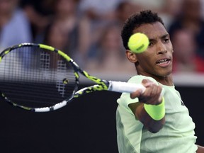 Felix Auger-Aliassime of Canada plays a forehand return to Daniil Medvedev of Russia during their third-round match at the Australian Open tennis championships at Melbourne Park, Melbourne, Australia, Saturday, Jan. 20, 2024. Auger-Aliassime advanced to the quarterfinals of the Open Sud de France tennis tournament with a razor-thin 7-5, 2-6, 7-6 (4) win over France's Arthur Cazaux on Thursday.
