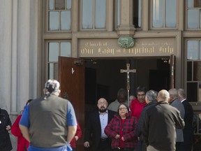 Attendees exit Our Lady of Perpetual Help Church after the funeral of Lisa Lopez-Galvan Saturday, Feb. 24, 2024 in Kansas City, Mo. Lisa Lopez-Galvan was one of about two dozen people who were shot when gunfire erupted Feb. 14 outside the city's Union Station.