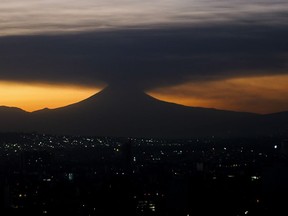 The Popocatepetl volcano emits smoke and ash, seen from Mexico City at sunrise on Tuesday, Feb. 27, 2024. The volcano known as "Don Goyo" has been active since 1994.