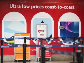 Lynx Air signage is displayed at the John C. Munro Hamilton International Airport in Hamilton, Ont., Friday, February 23, 2024. Officials with the Calgary-based company announced that it is ceasing operations after filing for creditor protection.