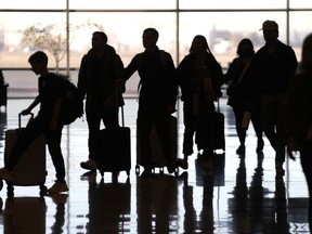 Silhouette of passengers waiting to board a plane