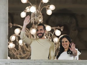 El Salvador President Nayib Bukele, left, accompanied by his wife Gabriela Rodriguez, wave to supporters from the balcony of the presidential palace in San Salvador, El Salvador, after polls closed for general elections on Sunday, Feb. 4, 2024. El Salvador President Bukele and his New Ideas party have won the supermajority the leader needs in Congress to govern as he pleases, electoral officials announced Monday, Feb. 19.