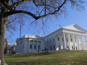 FILE - Visitors mill around the Virginia State Capitol in Richmond, Va., Jan. 8, 2020. Lawmakers in the Virginia House of Delegates this week voted down a bill that would have instituted a near-total abortion ban.