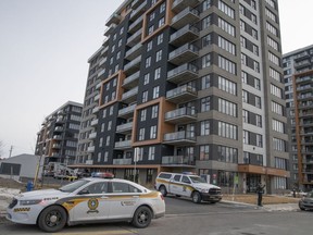 Surete du Quebec police outside an apartment in Vaudreuil-Dorion, Que., west of Montreal, where multiple people were stabbed, Thursday, Feb. 15, 2024.