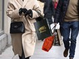 Statistics Canada says retail sales rose 0.9 per cent to $67.3 billion in December, helped by strength in sales at new car dealers. Shoppers walk in downtown Montreal, Tuesday, Dec. 19, 2023.