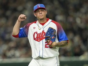 Pitcher Yariel Rodriguez of Cuba reacts during the World Baseball Classic quarterfinal game between Cuba and Australia at the Tokyo Dome Tokyo, Wednesday, March 15, 2023. The Toronto Blue Jays added some depth to their pitching staff Friday, agreeing to a US$32-million, five-year contract with Cuban right-hander Rodriguez.