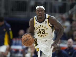 Indiana Pacers' Pascal Siakam dribbles during the first half of an NBA basketball game against the Golden State Warriors, Thursday, Feb. 8, 2024, in Indianapolis. Siakam is back in Toronto, for one game only. Siakam and his Indiana Pacers play the Raptors tonight.THE CANADIAN PRESS/AP/Darron Cummings