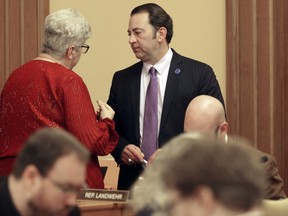 Kansas state Rep. Brenda Landwehr, left, R-Wichita, confers with Chair Troy Waymaster, right, R-Bunker Hill, during a meeting of the House Appropriations Committee, Wednesday, Feb. 28, 2024, at the Statehouse in Topeka, Kan. The committee has approved increased funding for home and community-based services for physically and intellectually disabled Kansans.