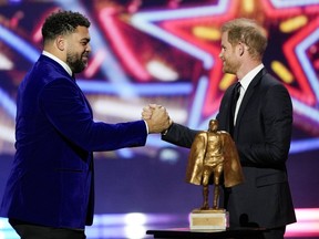 Prince Harry presenting Walter Payton Man of the Year Award to Cameron Heyward