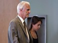 Former Quebec judge Jacques Delisle walks into court with his granddaughter Anne Sophie Morency, in 2012.
