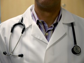 A doctor wears a stethoscope as he see a patient for a measles vaccination during a visit to the Miami Children's Hospital on June 2, 2014 in Miami, Florida.