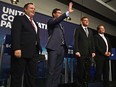 The end of the second official debate of the United Conservative Party leadership debate, from left, Jason Kenney, Doug Schweitzer, Brian Jean and Jeff Callaway, at the Expo Centre in Edmonton, September 28, 2017. Ed Kaiser/Postmedia