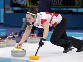 Canada's Joanne Courtney launches the stone during their women's curling match against Japan at the 2018 Winter Olympics in Gangneung, South Korea, Monday, Feb. 19, 2018. Former Team Homan member Joanne Courtney is enjoying the same big-game feelings from the broadcast booth that she did when she was a competitive curler.