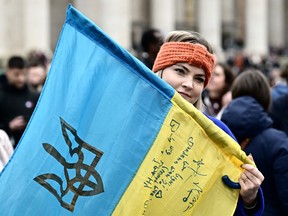 Woman holding Ukrainian flag