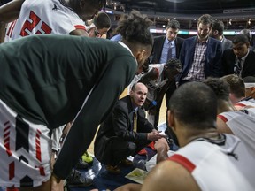 Carleton Ravens head coach Dave Smart speaks to his team during a timeout of quarterfinal action against the University of Alberta Golden Bears in the USports men's basketball national championship in Halifax on Friday, March 8, 2019.