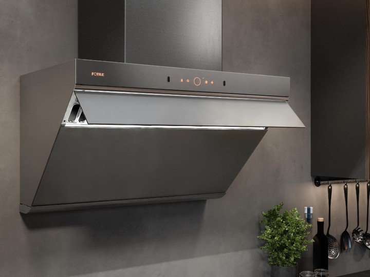  Fotile’s whisper-quiet range hood in a subtle, dark brushed-stainless finish has minimalist controls.