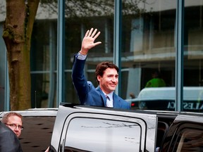 Canadian Prime Minister Justin Trudeau waves to onlookers as he leaves a press conference after after announcing a new Amazon Vancouver headquarters to bring 3,000 jobs on April 30, 2018 in Vancouver, British Columbia, Canada.