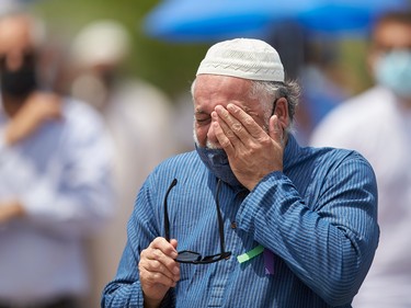 A man wipes away a tear during the funeral service for the Afzaal family on June 12, 2021..